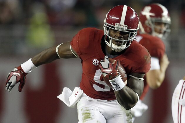 Alabama running back Bo Scarbrough (9) carries the ball during the second half of an NCAA football game against Charleston Southern, Saturday, Nov. 21, 2015, in Tuscaloosa, Ala. Alabama won 56-6. (AP Photo/Butch Dill)
