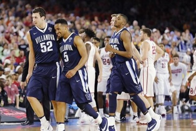 Villanova players including Phil Booth (5) and  Kevin Rafferty (52) walks off the court after an NCAA Final Four tournament college basketball semifinal game against Oklahoma Saturday, April 2, 2016, in Houston. Villanova won 95-51.(AP Photo/Kiichiro Sato)