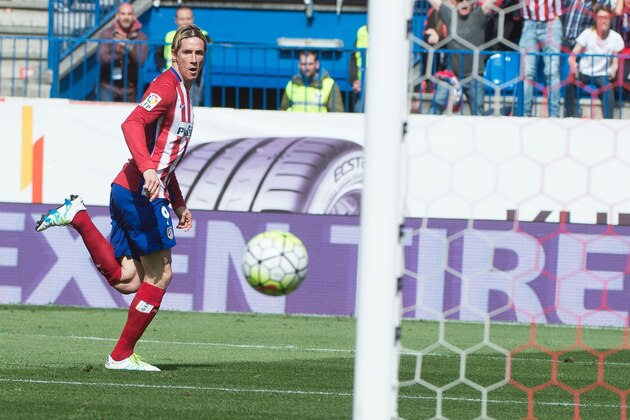 Atletico Madrid's forward Fernando Torres scores during the Spanish league football match Club Atletico de Madrid vs Real Betis Balompi at the Vicente Calderon stadium in Madrid on April 2, 2016. / AFP / CURTO DE LA TORRE        (Photo credit should read CURTO DE LA TORRE/AFP/Getty Images)