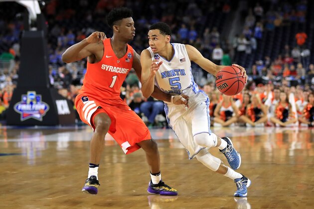 HOUSTON, TEXAS - APRIL 02:  Marcus Paige #5 of the North Carolina Tar Heels drives against Franklin Howard #1 of the Syracuse Orange in the second half during the NCAA Men's Final Four Semifinal at NRG Stadium on April 2, 2016 in Houston, Texas.  (Photo by Ronald Martinez/Getty Images)