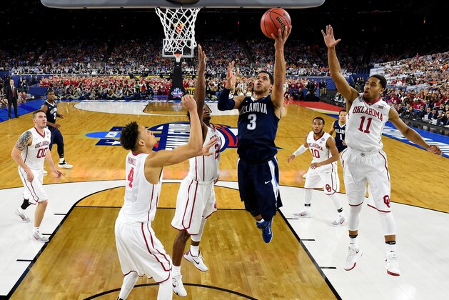 HOUSTON, TEXAS - APRIL 02:  Josh Hart #3 of the Villanova Wildcats drives to the basket against Jamuni McNeace #4 of the Oklahoma Sooners, Buddy Hield #24, and Isaiah Cousins #11 in the second half during the NCAA Men's Final Four Semifinal at NRG Stadium on April 2, 2016 in Houston, Texas.  (Photo by Robert Deutsch - Pool/Getty Images)