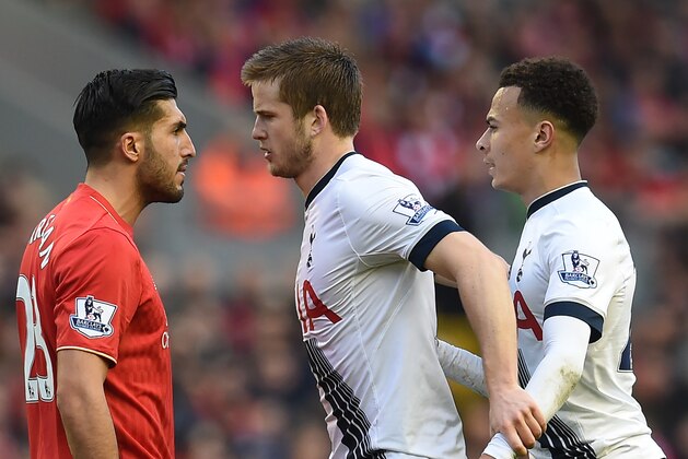 Liverpool's German midfielder Emre Can (L) clashes with Tottenham Hotspur's English defender Eric Dier and Tottenham Hotspur's English midfielder Dele Alli (R) during the English Premier League football match between Liverpool and Tottenham Hotspur at Anfield in Liverpool, north west England on April 2, 2016. / AFP / Paul ELLIS / RESTRICTED TO EDITORIAL USE. No use with unauthorized audio, video, data, fixture lists, club/league logos or 'live' services. Online in-match use limited to 75 images, no video emulation. No use in betting, games or single club/league/player publications.  /         (Photo credit should read PAUL ELLIS/AFP/Getty Images)