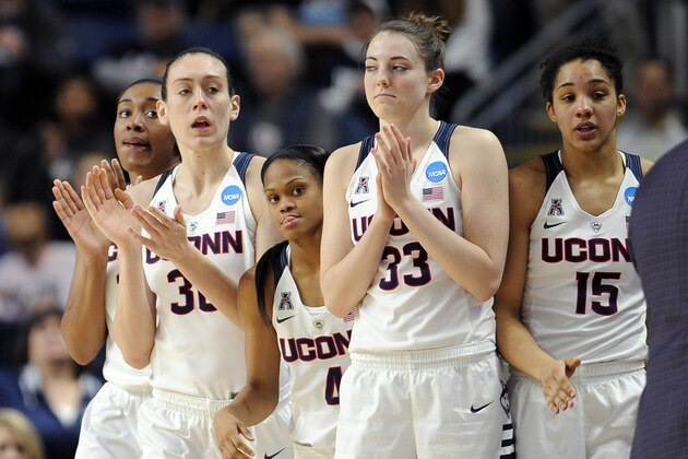 From left, Connecticut’s Morgan Tuck, Breanna Stewart, Moriah Jefferson, Katie Lou Samuelson and Gabby Williams watch the last moments of an NCAA college basketball game against Mississippi State in the regional semifinals of the women's NCAA Tournament, Saturday, March 26, 2016, in Bridgeport, Conn. UConn won 98-38. (AP Photo/Jessica Hill)