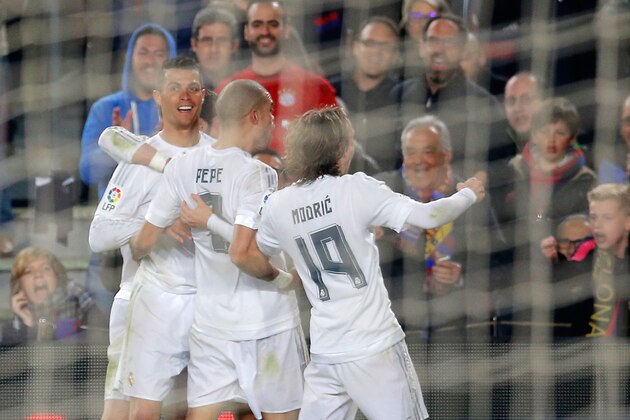 Real Madrid's Cristiano Ronaldo, left, celebrates after scoring his side’s second goal during a Spanish La Liga soccer match between Barcelona and Real Madrid, dubbed 'el clasico', at the Camp Nou stadium in Barcelona, Spain, Saturday, April 2, 2016. (AP Photo/Manu Fernandez)