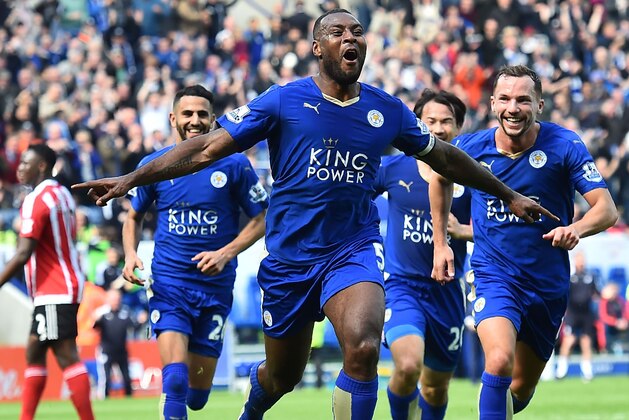 Leicester City's English defender Wes Morgan (C) celebrates after scoring during the English Premier League football match between Leicester City and Southampton at King Power Stadium in Leicester, central England on April 3, 2016. / AFP / BEN STANSALL / RESTRICTED TO EDITORIAL USE. No use with unauthorized audio, video, data, fixture lists, club/league logos or 'live' services. Online in-match use limited to 75 images, no video emulation. No use in betting, games or single club/league/player publications.  /         (Photo credit should read BEN STANSALL/AFP/Getty Images)