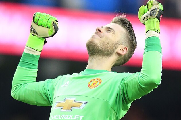 United’s goalkeeper David de Gea celebrates after his team won the English Premier League soccer match between Manchester City and Manchester United at the Etihad stadium in Manchester, Sunday, March 20, 2016.(AP Photo/Jon Super)