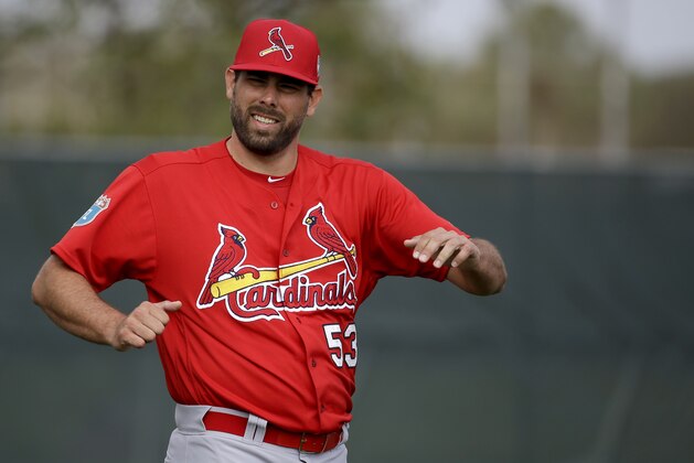 St. Louis Cardinals pitcher Jordan Walden stretches during spring training baseball practice Sunday, Feb. 21, 2016, in Jupiter, Fla. (AP Photo/Jeff Roberson)