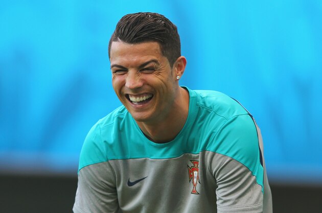 SALVADOR, BRAZIL - JUNE 15:  Cristiano Ronaldo laughs during the Portugal training session ahead of the 2014 FIFA World Cup Group G match between Germany and Portugal held at the Arena Fonte Nova on June 15, 2014 in Salvador, Brazil.  (Photo by Martin Rose/Getty Images)