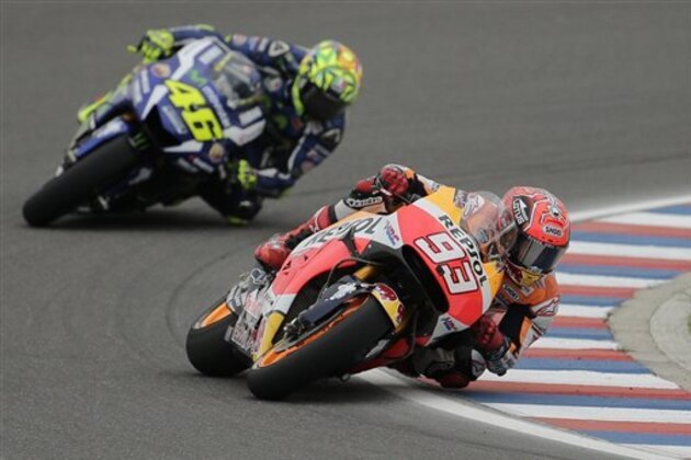 Marc Marquez of Spain rides his Honda, right, ahead of Valentino Rossi of Italy, during the Motorcycle Grand Prix at the Termas de Rio Hondo circuit in Argentina, Sunday, April 3, 2016. (AP Photo/Victor R. Caivano)