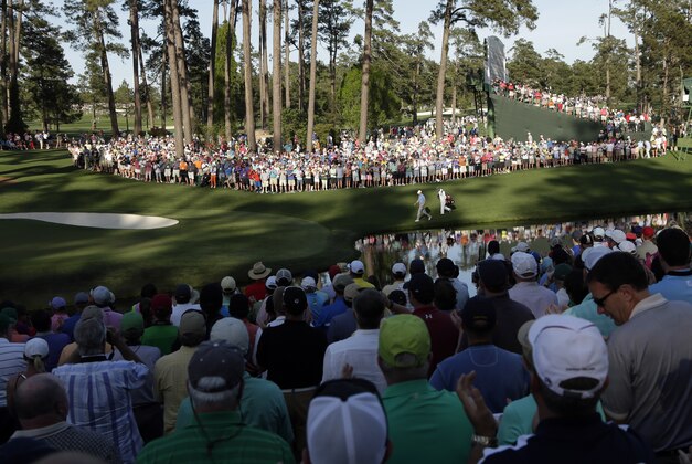 Jordan Spieth walks down the 16th fairway during the third round of the Masters golf tournament Saturday, April 11, 2015, in Augusta, Ga. (AP Photo/Charlie Riedel)