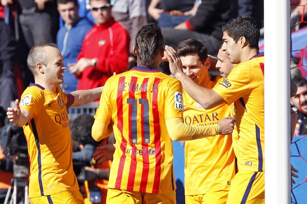 Barcelona's Jordi Alba, second right,  celebrates with Lionel Messi, third right, Luis Suarez, right, Neymar,  foreground and Iniesta, left, after Jordi scored a goal,  during a Spanish La Liga soccer match between Levante and Barcelona,  at the Ciutat de Valencia stadium in Valencia, Spain, Sunday, Feb. 7, 2016. (AP Photo/Alberto Saiz)