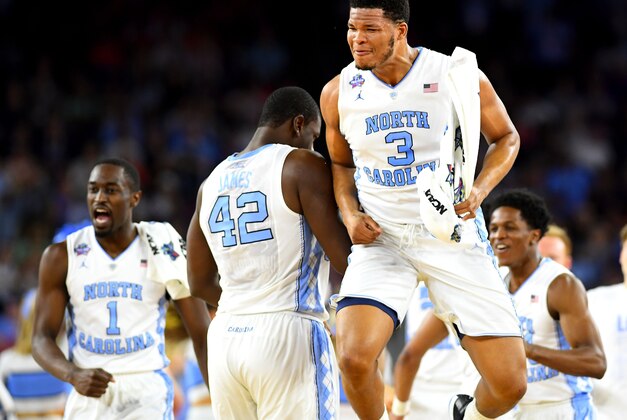 Apr 2, 2016; Houston, TX, USA; North Carolina Tar Heels forward Kennedy Meeks (3) celebrates with forward Joel James (42) during the first half against the Syracuse Orange in the 2016 NCAA Men's Division I Championship semi-final game at NRG Stadium. Mandatory Credit: Bob Donnan-USA TODAY Sports