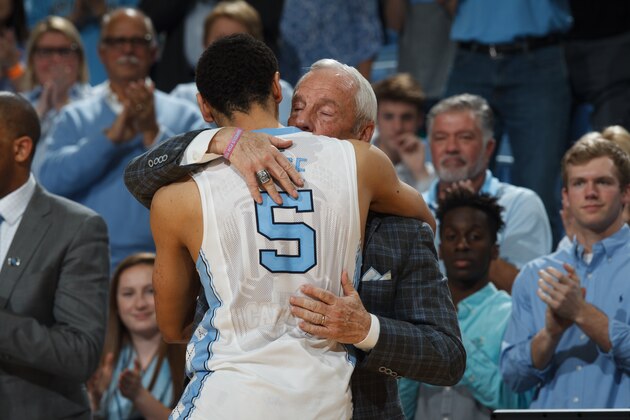 CHAPEL HILL, NC - FEBRUARY 29: Marcus Paige #5 of the North Carolina Tar Heels hugs head coach Roy Williams after a game against the Syracuse Orange on February 29, 2016 at the Dean E. Smith Center in Chapel Hill, North Carolina. North Carolina won 75-70. (Photo by Peyton Williams/UNC/Getty Images)