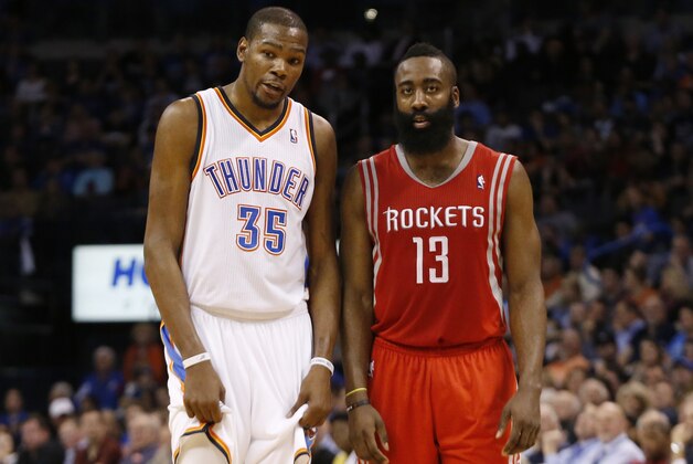 Oklahoma City Thunder forward Kevin Durant (35) and Houston Rockets guard James Harden (13) talk during a foul shot in the fourth quarter of an NBA basketball game in Oklahoma City, Tuesday, March 11, 2014. Oklahoma City won 106-98. (AP Photo/Sue Ogrocki)