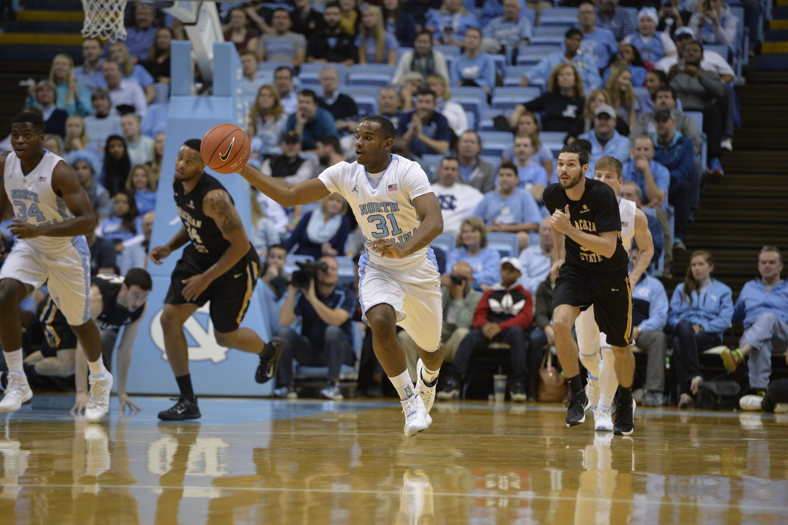 UNC senior guard Justin Coleman dribbles up the court against Appalachian State this season.