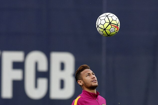 FC Barcelona's Neymar eyes the ball during a training session at the Sports Center FC Barcelona Joan Gamper in San Joan Despi, Spain, Friday, April 1, 2016. FC Barcelona will play against Real Madrid Saturday in a Spanish La Liga soccer match, dubbed 'el clasico'. (AP Photo/Manu Fernandez)