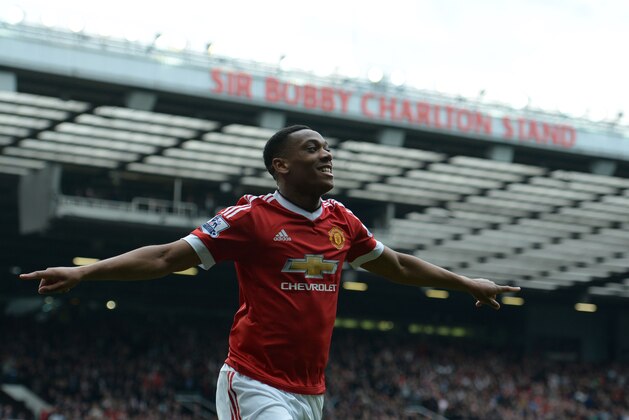 Manchester United's French striker Anthony Martial celebrates scoring the opening goal during the English Premier League football match between Manchester United and Everton at Old Trafford in Manchester, north west England, on April 3, 2016. / AFP / OLI SCARFF / RESTRICTED TO EDITORIAL USE. No use with unauthorized audio, video, data, fixture lists, club/league logos or 'live' services. Online in-match use limited to 75 images, no video emulation. No use in betting, games or single club/league/player publications.  /         (Photo credit should read OLI SCARFF/AFP/Getty Images)