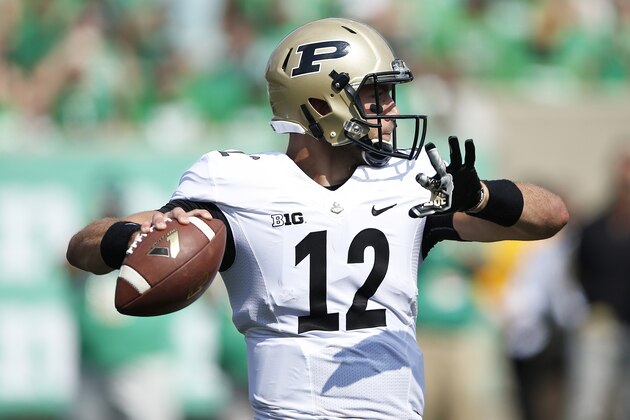 HUNTINGTON, WV - SEPTEMBER 6: Austin Appleby #12 of the Purdue Boilermakers looks to pass against the Marshall Thundering Herd at Joan C. Edwards Stadium on September 6, 2015 in Huntington, West Virginia. Marshall defeated Purdue 41-31. (Photo by Joe Robbins/Getty Images)