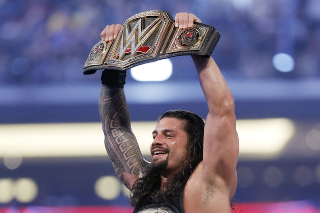 IMAGE DISTRIBUTED FOR WWE - WWE superstar new world heavy weight champion Roman Reigns celebrates his victory at WrestleMania 32 at AT&T Stadium on Sunday, April 3, 2016, in Arlington, Texas. (Brandon Wade/AP Images for WWE)