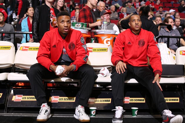 PORTLAND, OR - MARCH 23:  Damian Lillard #0 and C.J. McCollum #3 of the Portland Trail Blazers sit on the bench before the game against the Dallas Mavericks on March 23, 2016 at the Moda Center Arena in Portland, Oregon. NOTE TO USER: User expressly acknowledges and agrees that, by downloading and or using this photograph, user is consenting to the terms and conditions of the Getty Images License Agreement. Mandatory Copyright Notice: Copyright 2016 NBAE (Photo by Sam Forencich/NBAE via Getty Images)