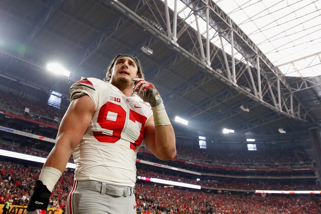 GLENDALE, AZ - JANUARY 01:  Defensive lineman Joey Bosa #97 of the Ohio State Buckeyes walks off the field after being ejected for targeting during the first quarter of the BattleFrog Fiesta Bowl against the Notre Dame Fighting Irish at University of Phoenix Stadium on January 1, 2016 in Glendale, Arizona.  The Buckeyes defeated the Fighting Irish 44-28.  (Photo by Christian Petersen/Getty Images)
