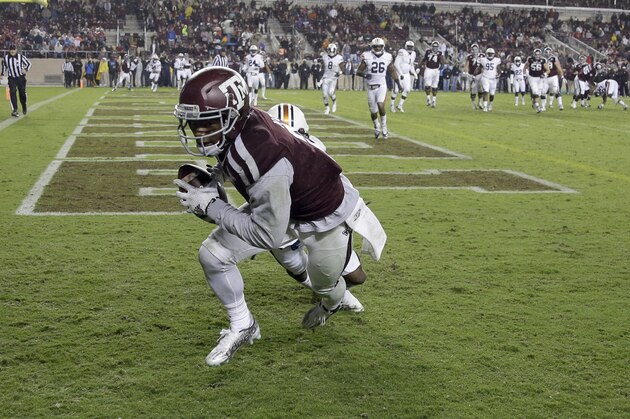 Texas A&M wide receiver Speedy Noil catches a touchdown pass as Auburn defensive back Jonathan Jones defends  during the second half of an NCAA college football game Saturday, Nov. 7, 2015, in College Station, Texas. Auburn won 26-10. (AP Photo/David J. Phillip)