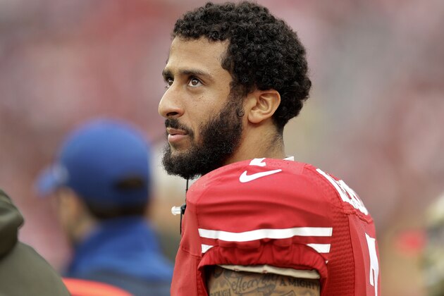 FILE - In this Nov. 8, 2015, file photo, San Francisco 49ers quarterback Colin Kaepernick stands on the field during an NFL football game against the Atlanta Falcons in Santa Clara, Calif. After months of trade talk and speculation, Kaepernick is still on the 49er's roster and due a hefty payday. The quarterback's $11.9 million 2016 contract became guaranteed at 1 p.m. local time Thursday, March 31, 2016, when the 49ers kept him on the roster. (AP Photo/Ben Margot, File)