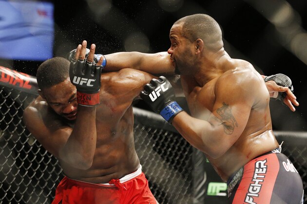 Daniel Cormier hits Jon Jones during their light heavyweight title mixed martial arts bout at UFC 182, Saturday, Jan. 3, 2015, in Las Vegas. (AP Photo/John Locher)