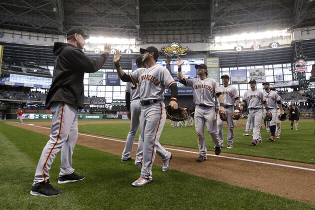 MILWAUKEE, WI - APRIL 04: The San Francisco Giants celebrates after the 12-3 win over the Milwaukee Brewers on Opening Day at Miller Park on April 04, 2016 in Milwaukee, Wisconsin. (Photo by Mike McGinnis/Getty Images)