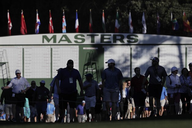 Spectators make their way to the first fairway during a practice round for the Masters golf tournament, Monday, April 4, 2016, in Augusta, Ga. (AP Photo/Jae C. Hong)