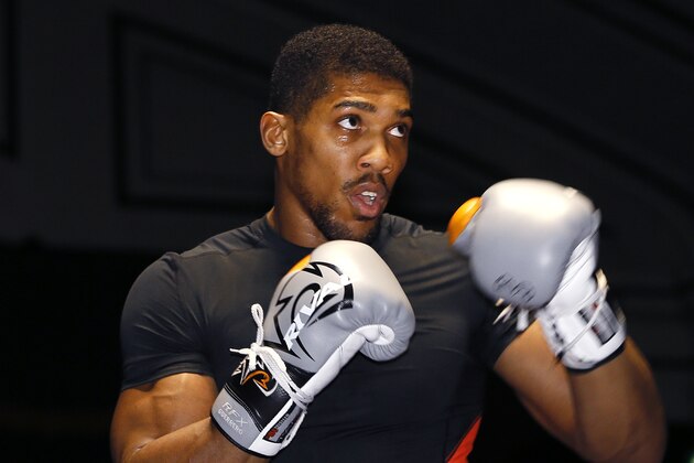Boxer Anthony Joshua of Britain during a public workout in London, Monday, April 4, 2016. There will be an IBF World Heavyweight title fight between champion Charles Martin of the USA and unbeaten British Olympic star Anthony Joshua in London on Saturday April 9. (AP Photo/Kirsty Wigglesworth)