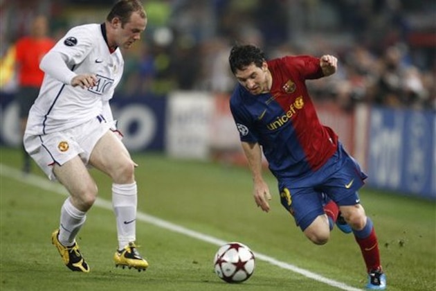 Manchester United's Wayne Rooney, left, and Barcelona's Lionel Messi during the UEFA Champions League final soccer match between Manchester United and Barcelona in Rome, Wednesday May 27, 2009. (AP Photo/Luca Bruno)