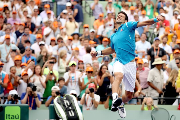 KEY BISCAYNE, FL - APRIL 03:  Novak Djokovic of Serbia celebrates his win over Kei Nishikori of Japan during the final on Day 14 of the Miami Open presented by Itau at Crandon Park Tennis Center on April 3, 2016 in Key Biscayne, Florida.  (Photo by Matthew Stockman/Getty Images)