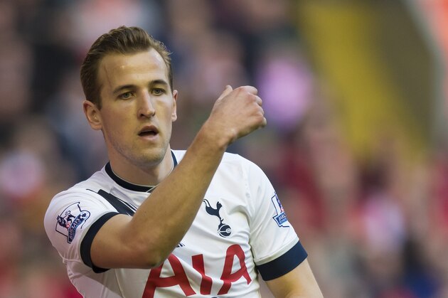 Tottenham's Harry Kane throws a ball for a corner during the English Premier League soccer match between Liverpool and Tottenham Hotspur at Anfield Stadium, Liverpool, England, Saturday, April 2, 2016. (AP Photo/Jon Super)