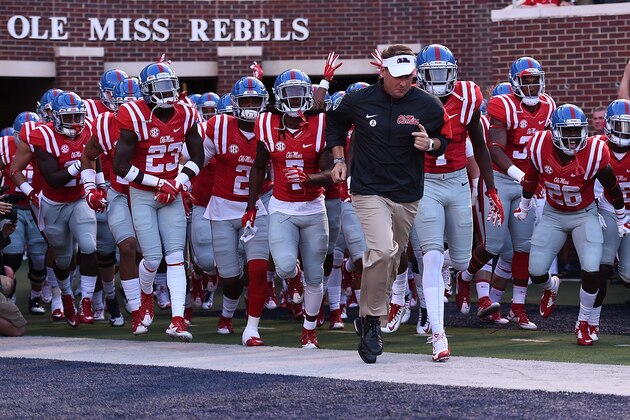 OXFORD, MS - SEPTEMBER 26:  Head coach Hugh Freeze of the Mississippi Rebels leads his team onto the field prior to a game against the Vanderbilt Commodores at Vaught-Hemingway Stadium on September 26, 2015 in Oxford, Mississippi.  Mississippi defeated Vanderbilt 27-16.  (Photo by Stacy Revere/Getty Images)