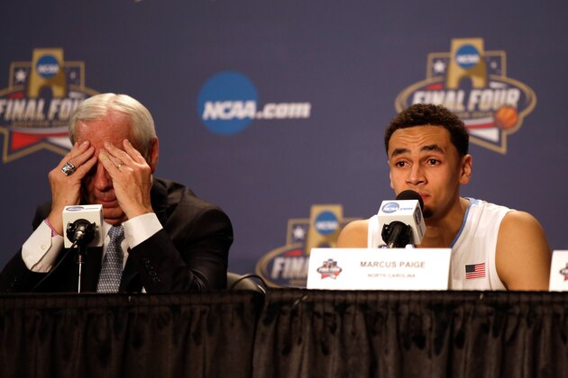 HOUSTON, TEXAS - APRIL 04:  Head coach Roy Williams of the North Carolina Tar Heels and Marcus Paige #5 react after being defeated by the Villanova Wildcats 77-74 in the 2016 NCAA Men's Final Four National Championship game at NRG Stadium on April 4, 2016 in Houston, Texas.  (Photo by Justin Heiman/Getty Images)