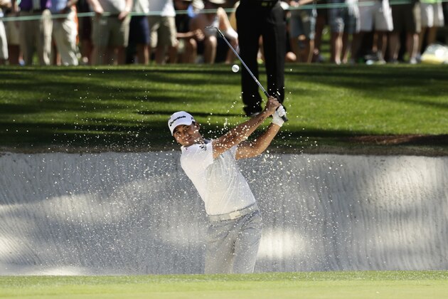 Jason Day, of Australia,  hits out of a bunker on the 16th hole during a practice round for the Masters golf tournament, Monday, April 4, 2016, in Augusta, Ga. (AP Photo/Charlie Riedel)