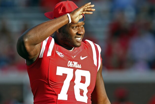 In this Sept. 26, 2015, photograph, Mississippi offensive lineman Laremy Tunsil (78) looks into the stands prior to their NCAA college football game against Vanderbilt, in Oxford, Miss. The NCAA has ruled that Tunsil can return to the field on Saturday, Oct. 24 against No. 15 Texas A&M after a seven-game suspension for receiving improper benefits. (AP Photo/Rogelio V. Solis)