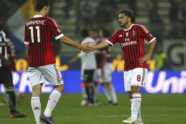 PARMA, ITALY - MARCH 17:  Zlatan Ibrahimovic (L) and Gennaro Gattuso (R) of AC Milan celebrate a victory at the end of the Serie A match between Parma FC and AC Milan at Stadio Ennio Tardini on March 17, 2012 in Parma, Italy.  (Photo by Marco Luzzani/Getty Images)