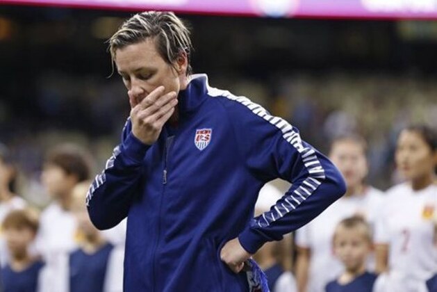 U.S. forward Abby Wambach reacts during a presentation to her before the team's international friendly soccer match against China in New Orleans, Wednesday, Dec. 16, 2015. Wambach retired from international competition after the game. (AP Photo/Gerald Herbert)