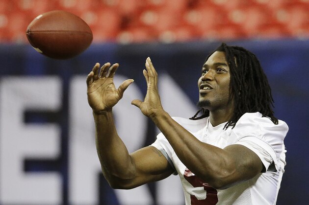 Alabama running back Bo Scarbrough catches a pass during a team workout ahead of Saturday's Southeastern Conference championship NCAA college football game against Florida, Friday, Dec. 4, 2015, in Atlanta. (AP Photo/David Goldman)