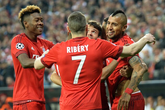 Bayern's Arturo Vidal, right, celebrates with Bayern's Franck Ribery after scoring a goal during the Champions League quarterfinal first leg soccer match between FC Bayern Munich and Benfica Lisbon at the Allianz Arena in Munich, southern Germany, Tuesday, April 5, 2016. (AP Photo/Kerstin Joensson)
