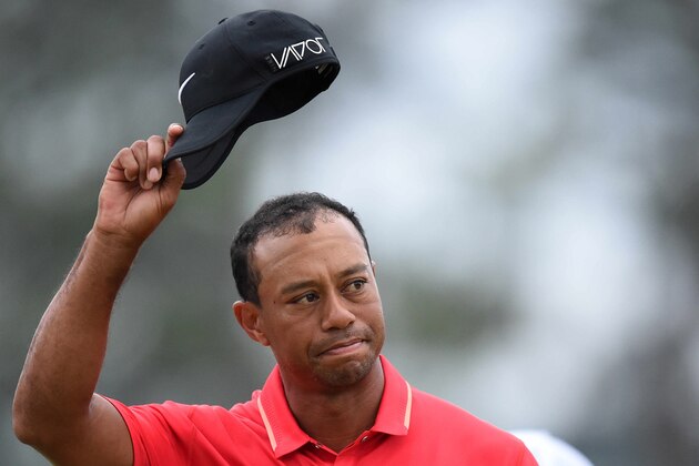 Tiger Woods of the US waves to the crowd on the 18th green during 79th Masters Golf Tournament at Augusta National Golf Club on April 12, 2015, in Augusta, Georgia. AFP PHOTO/JIM WATSON        (Photo credit should read JIM WATSON/AFP/Getty Images)