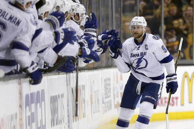 Tampa Bay Lightning's Steven Stamkos (91) celebrates after scoring on a penalty shot during the second period of an NHL hockey game against the Boston Bruins in Boston, Sunday, Feb. 28, 2016. (AP Photo/Michael Dwyer)