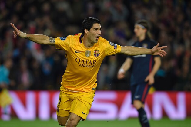 Barcelona's Uruguayan forward Luis Suarez after scoring a goal during the UEFA Champions League quarter finals first leg football match FC Barcelona vs Atletico de Madrid at the Camp Nou stadium in Barcelona on April 5, 2016. / AFP / LLUIS GENE        (Photo credit should read LLUIS GENE/AFP/Getty Images)
