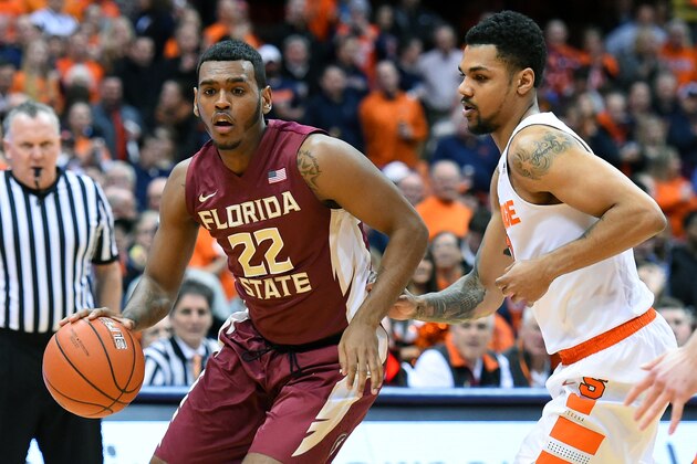 SYRACUSE, NY - FEBRUARY 11:  Xavier Rathan-Mayes #22 of the Florida State Seminoles drives to the basket past Michael Gbinije #0 of the Syracuse Orange during the first half at the Carrier Dome on February 11, 2016 in Syracuse, New York.  Syracuse won 85-72.  (Photo by Rich Barnes/Getty Images)