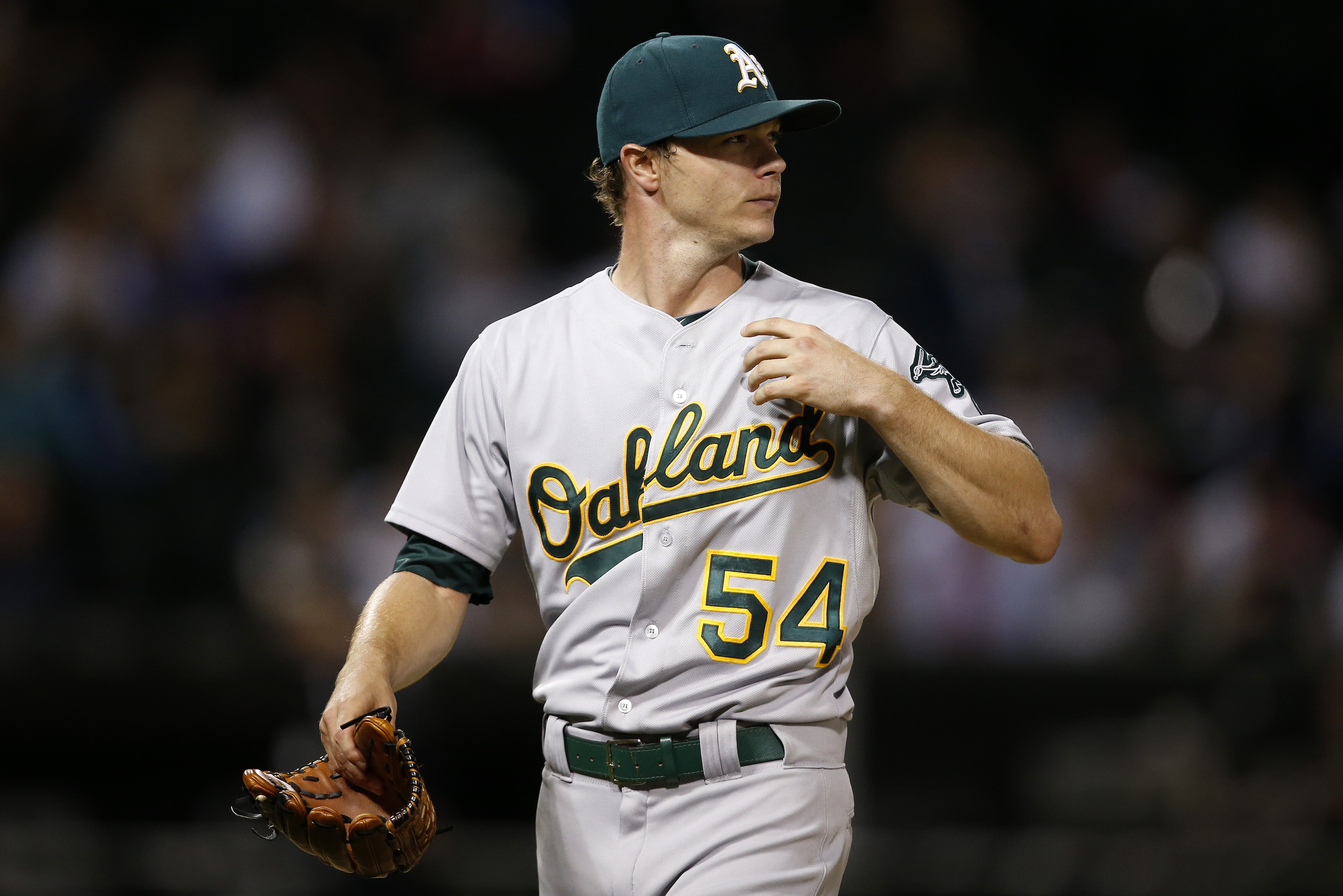 Oakland Athletics starting pitcher Sonny Gray heads to the dugout after being relieved during the fourth inning of a baseball game against the Chicago White Sox, Monday, Sept. 14, 2015, in Chicago. (AP Photo/Andrew A. Nelles)