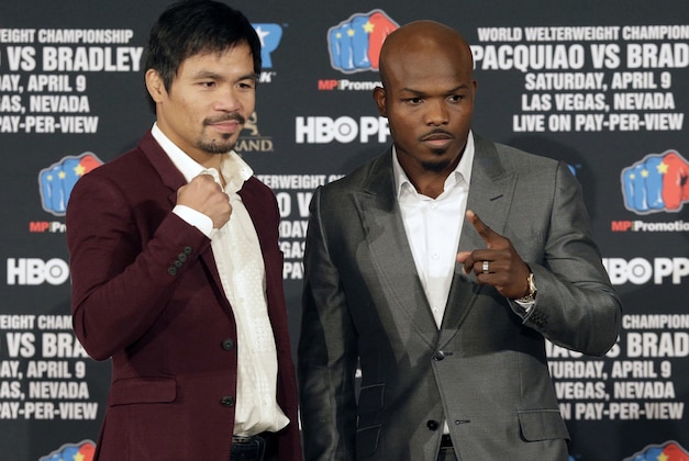 Manny Pacquiao, left, and Timothy Bradley Jr. pose during a news conference in Beverly Hills, Calif., on Tuesday, Jan. 19, 2016. Pacquiao and Bradley are scheduled to fight on April 9, 2016, in Las Vegas for Bradley's WBO welterweight title. (AP Photo/Nick Ut)