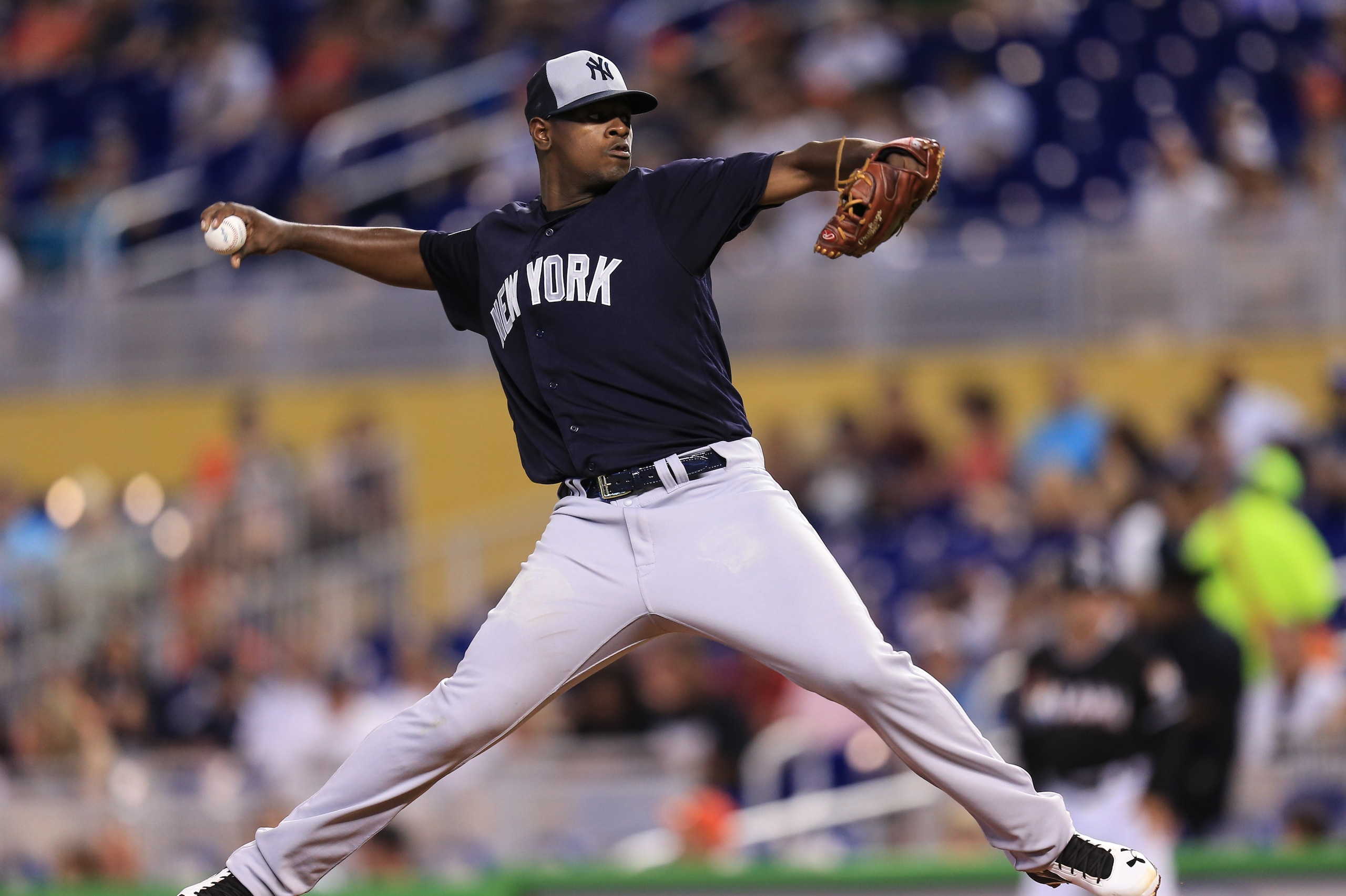 New York Yankees starting pitcher Luis Severino delivers a pitch during the first inning of an exhibition baseball game against the Miami Marlins on Saturday, April 2, 2016, in Miami. (AP Photo/Rob Foldy)