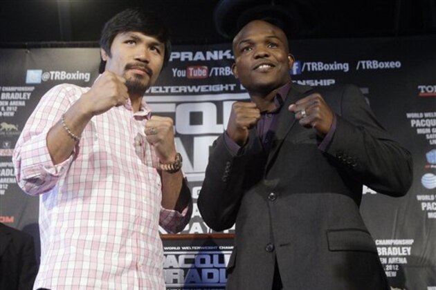 Boxers Manny Pacquiao, left, and Tim Bradley Jr., right, pose for photographs during a news conference, Thursday, Feb. 23, 2012, in New York, to promote an upcoming fight. Pacquiao and Bradley will fight on Saturday, June, 9, 2012 in Las Vegas, for Pacquiao's WBO welterweight championship. (AP Photo/Frank Franklin II)